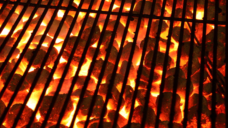 charcoal briquettes glowing in grill