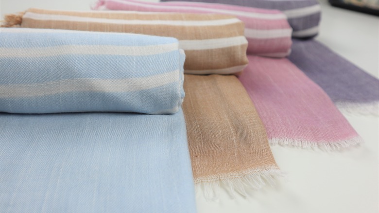 Four bright-colored Turkish towels