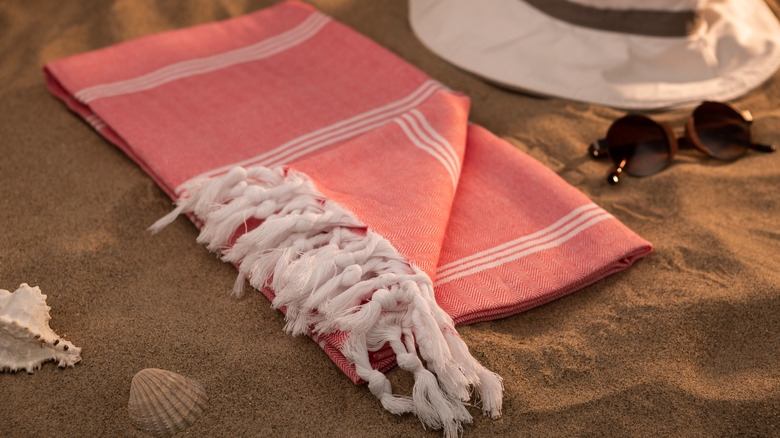 Red Turkish towel on beach