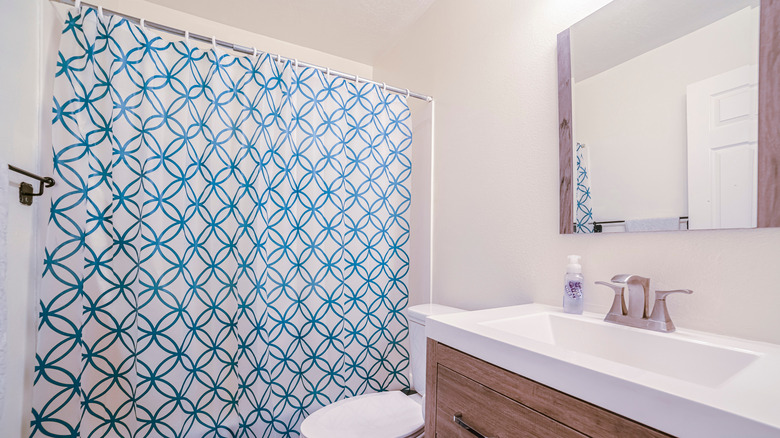 Hanging patterned shower curtain 