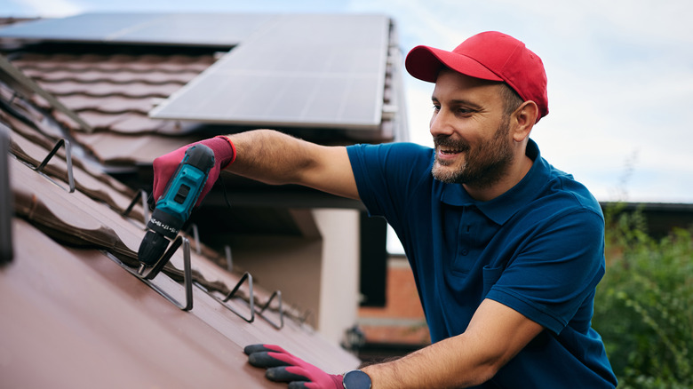A man working on a home's roof