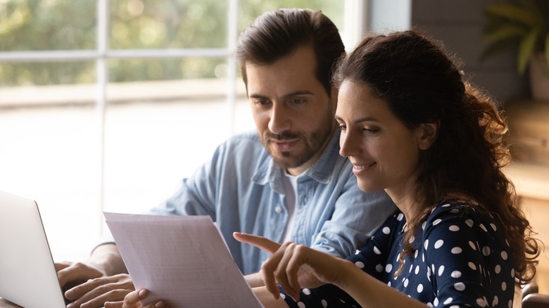 Couple reading letter