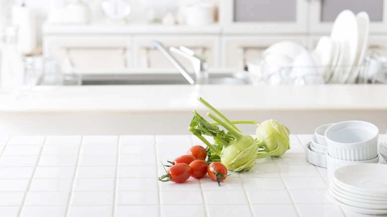 Tiled kitchen counter with vegetables