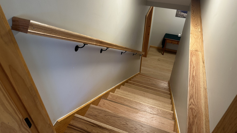 Stairs leading down to an open basement door