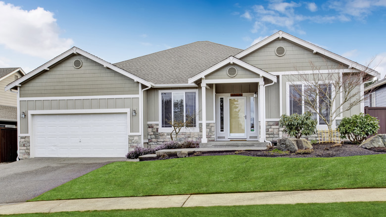 Gray house with yellow door