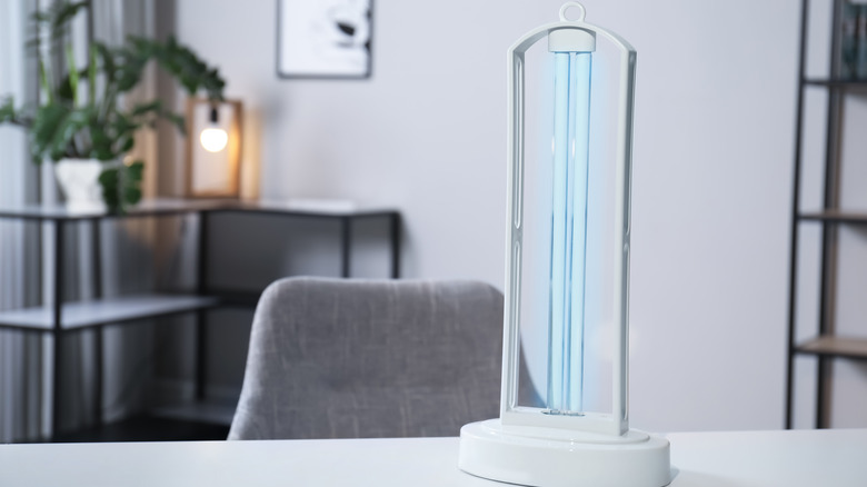 A UV sanitizing lamp on a table at home