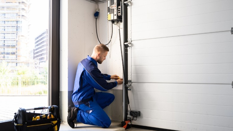Man working on garage door 