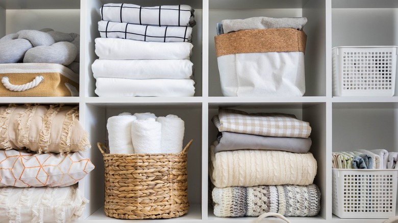 Folded linens on a shelf