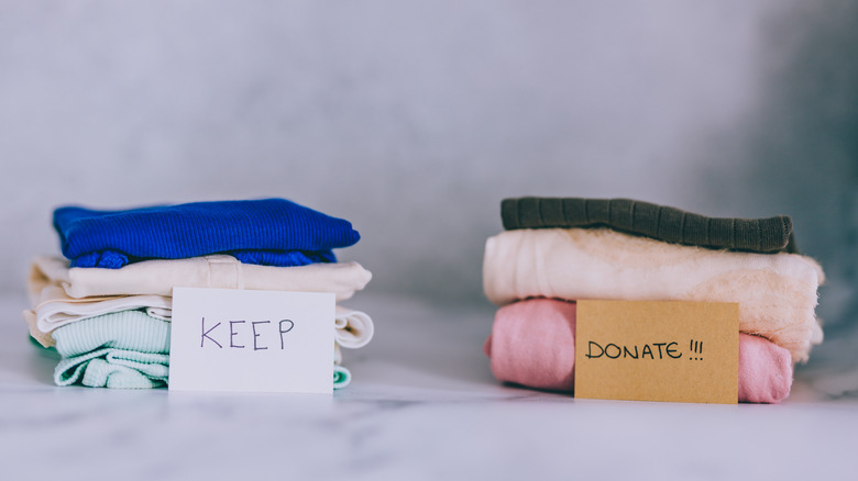 keep and donate clothes piles