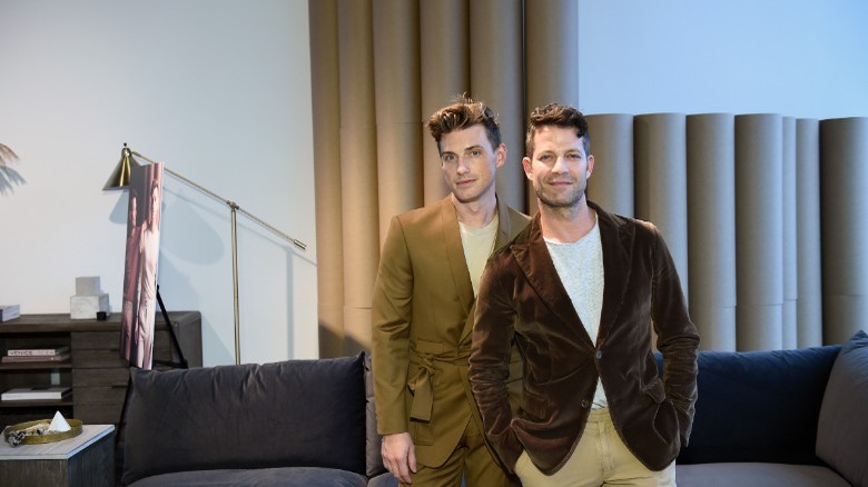 Jeremiah Brent and Nate Berkus in front of curtains