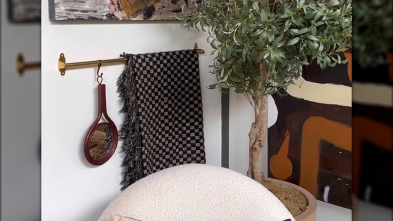 HULTARP rail with blanket hanging on wall