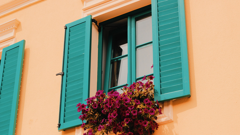 Teal shutters on a peach home