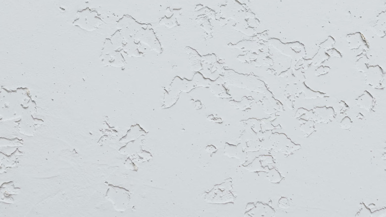 Flattened and pitted areas of the hand brocade ceiling texture