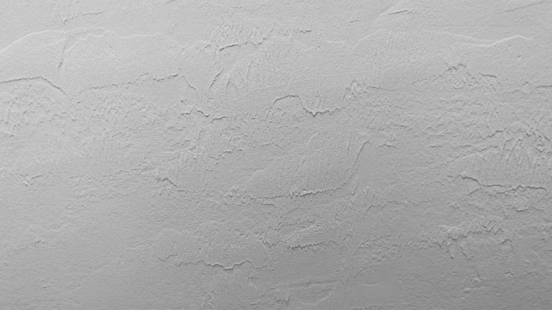 Closeup of raised and smoothed patches in skip trowel texture