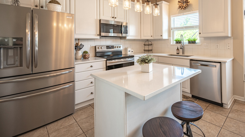 Kitchen with steel refrigerator