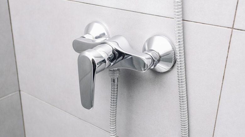 Close up of chrome shower faucet head