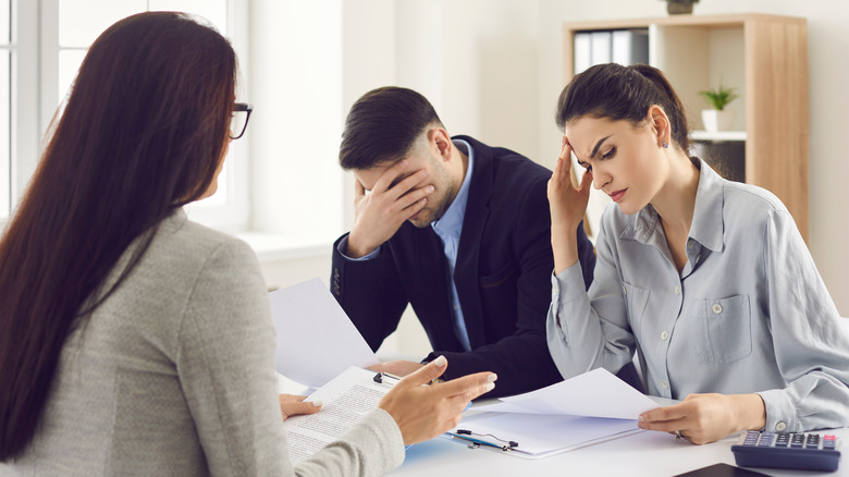 real estate agent and two disappointed clients 