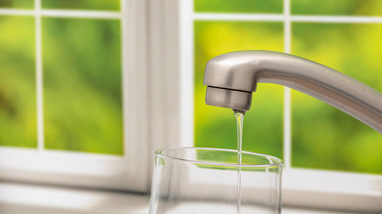 Water trickling out of a faucet with low pressure