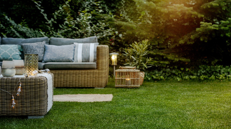 outdoor rattan furniture set sitting on grass