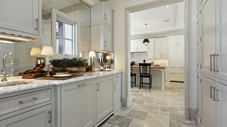 butler's pantry with plenty of cabinets