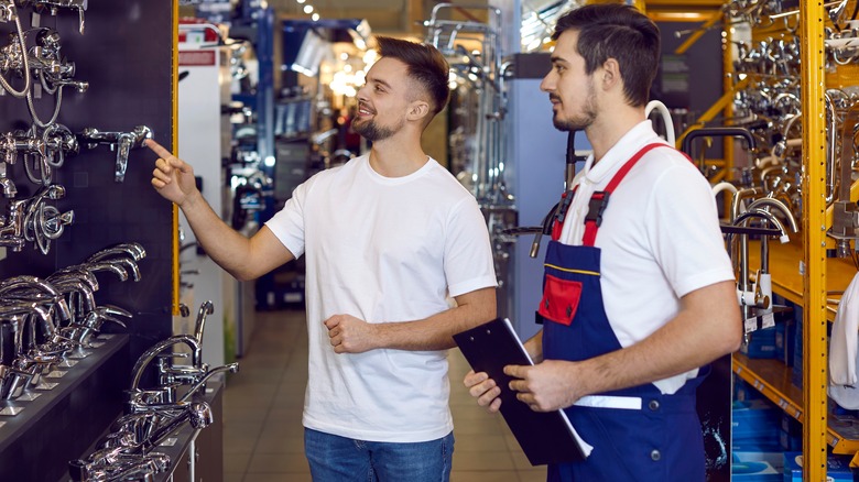 Person shopping for faucets