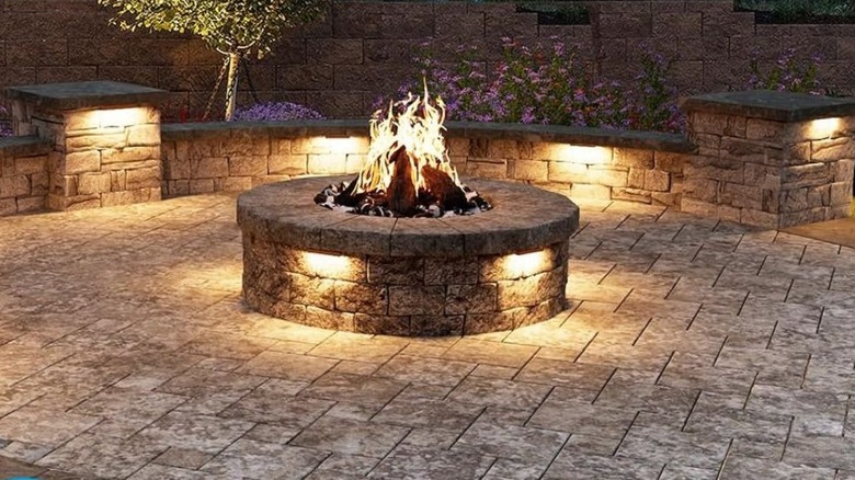 Retaining wall with lights and fire pit