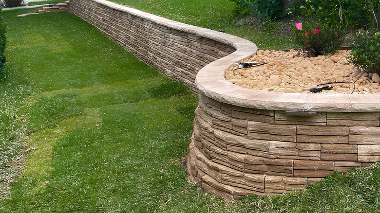 A plain rock retaining wall