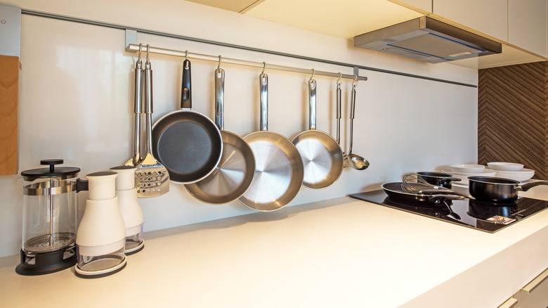 kitchen with wall rack of pots and pans