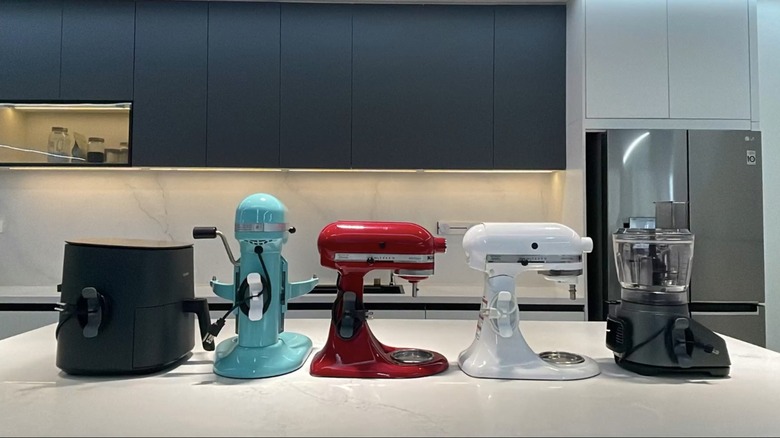 various countertop appliances with cord organizer attached