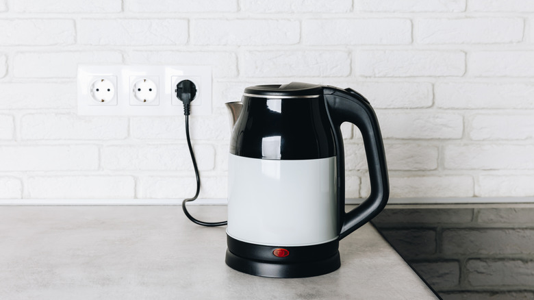 kettle on a counter plugged into outlet