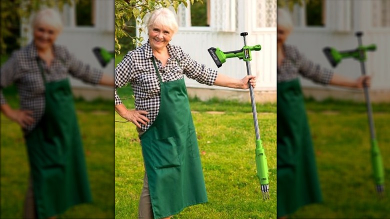 woman holding TaskStar weed pulling tool