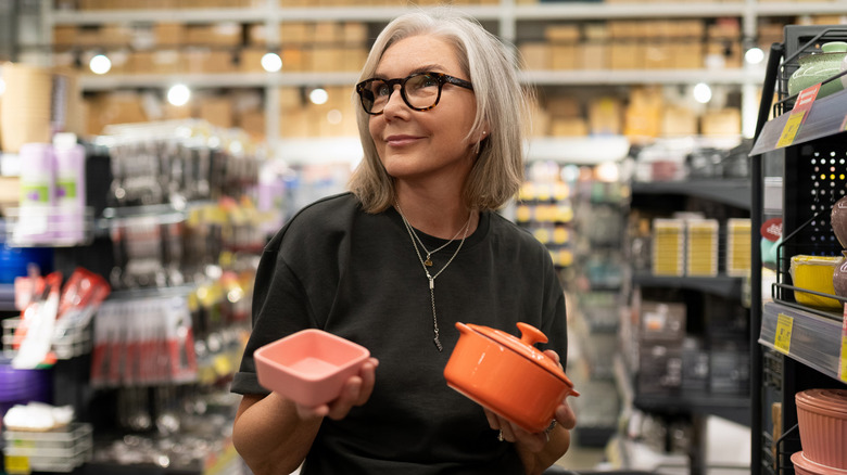 Older woman shopping for baking dishes