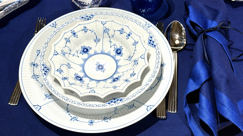 Blue and white Royal Copenhagen pottery on a table