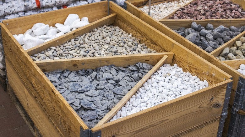 DIfferent types of gravel in an organizing box made of wood