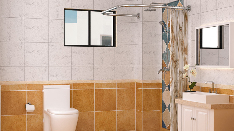 The U-Shaped Shower Curtain Rod in a bathroom with a shower in the corner against an uneven wall