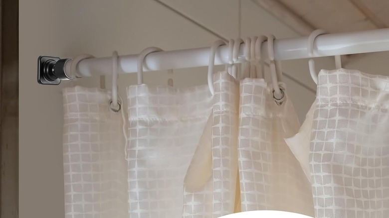 Newtay angle bracket curtain rod holder, holding white rod and white shower curtain
