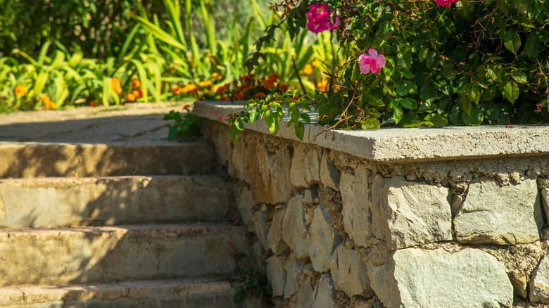 A retaining wall made out of stone with steps