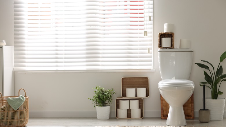 Photo of bathroom window with traditional blinds