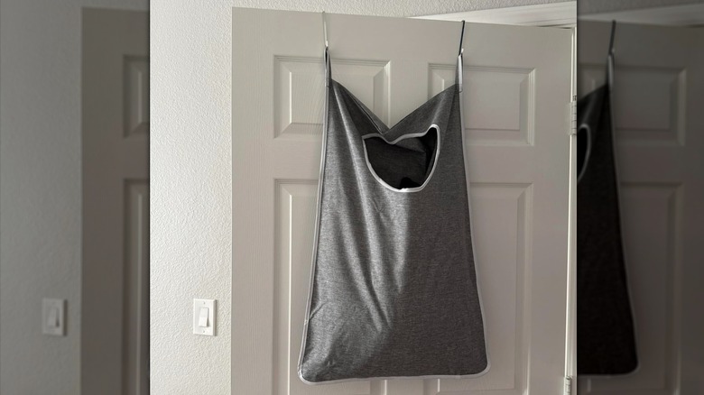 Customer photo of laundry bag hanging on the back of a door