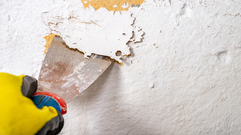 Scraping the textured finish off of a wall