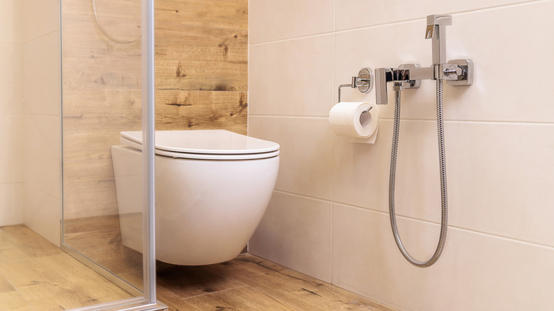 Concealed toilet in a tiled bathroom