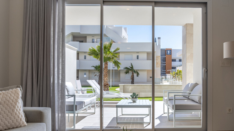Modern sliding door looking out to a back patio.