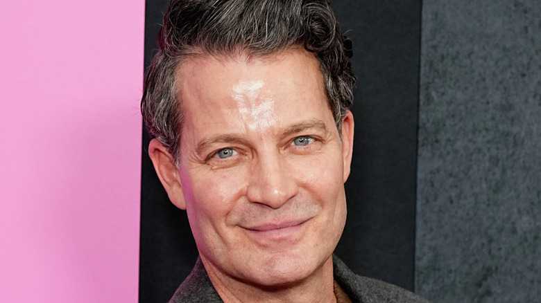 Nate Berkus holding a microphone