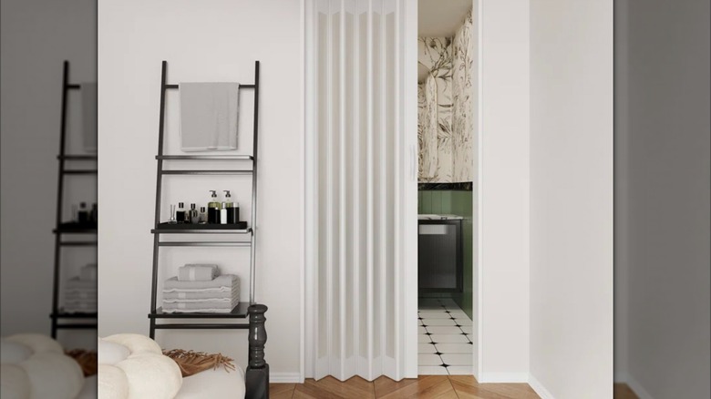 Accordion door leading from bedroom to ensuite.