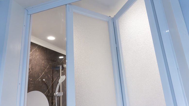 Bi-fold doors leading to a bathroom.