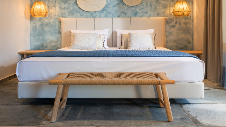 Small bedroom with light bedding