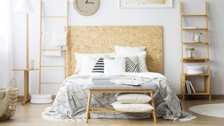 Bed with flanking ladders