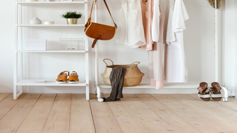 Garment rack with hanging clothes