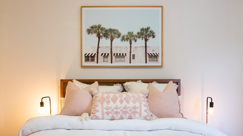 Pink bedroom with large artwork