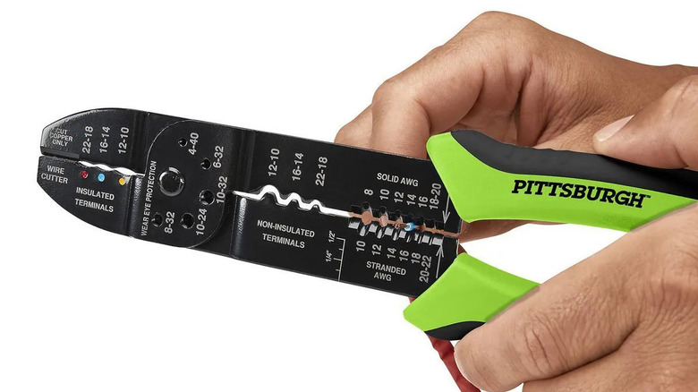 Close-up of a person holding Pittsburgh's 3-in-1 Multipurpose Stripper, Crimper, and Cutter